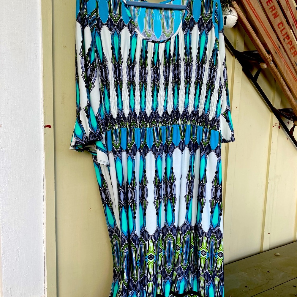 Hues of Turquoise, green, white, black dress.